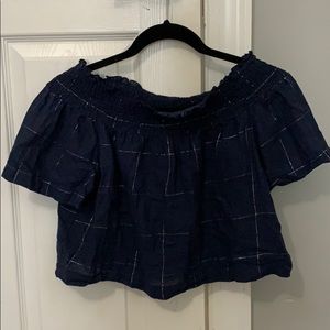 Cropped navy off the shoulder shirt.